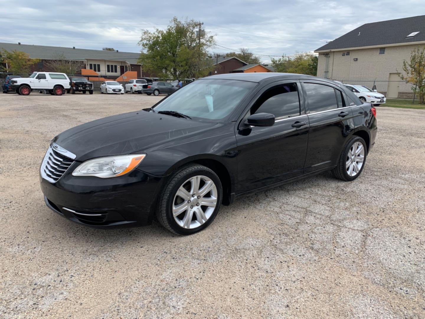 2012 Black /Black Chrysler 200 LX (1C3CCBAB3CN) with an 2.4L L4 DOHC 16V engine, Automatic transmission, located at 1830 North Belt Line Road, Irving, TX, 75061, (469) 524-0199, 32.834373, -96.993584 - Photo#2